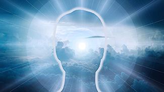 silhouette outline of man's head against blue sky, meditation