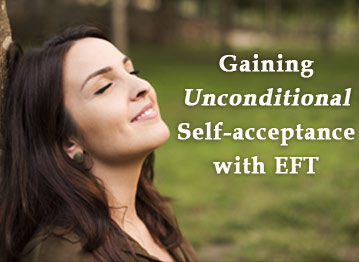 woman smiling, leaning against tree, self-acceptance with eft