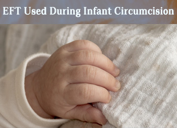 baby hand on white blanket, eft during infant circumcision